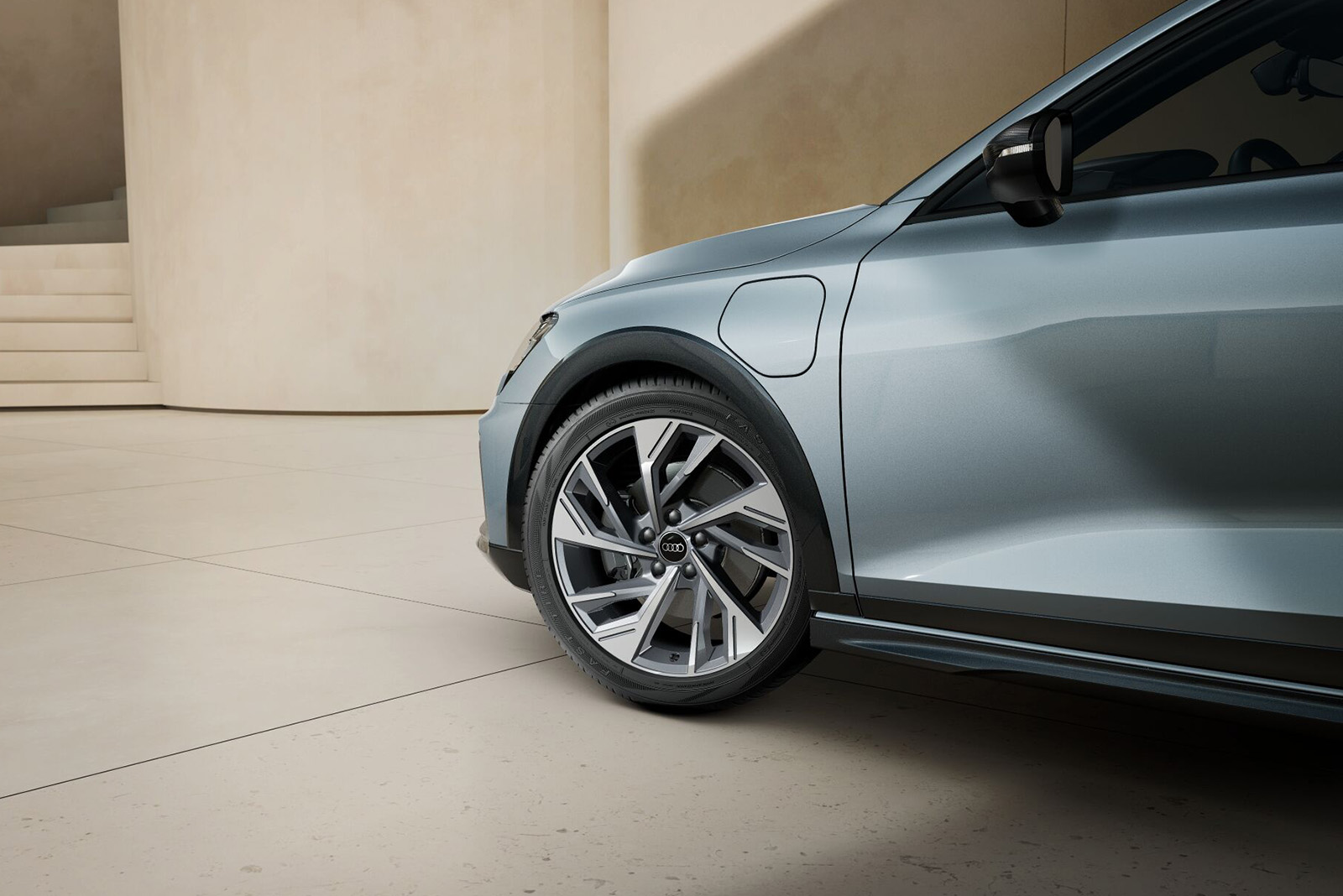 Audi A3 allstreet TFSI e, Detailaufnahme Vorderrad mit Ladeanschluss