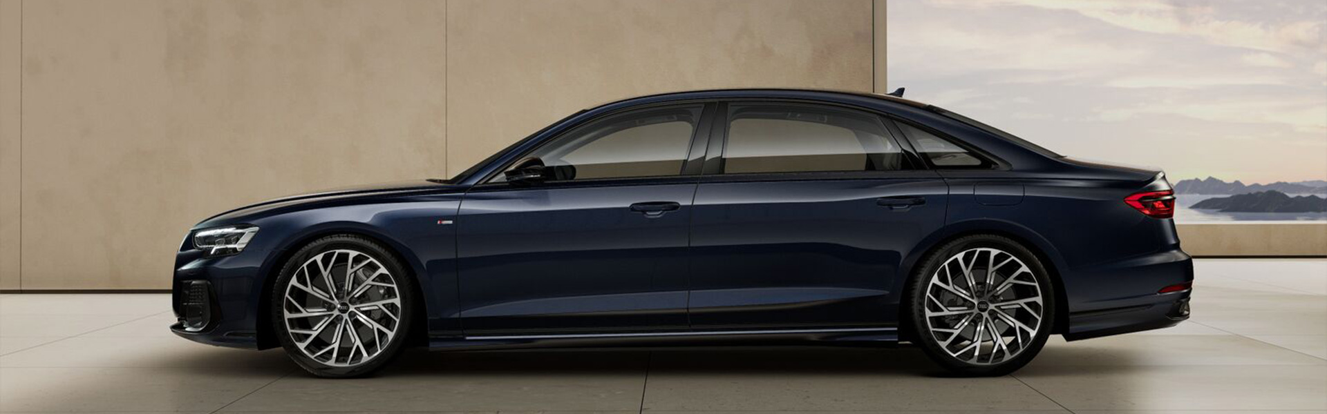 Audi A8L TFSI e in Firmamentblau Metallic in Frontansicht.